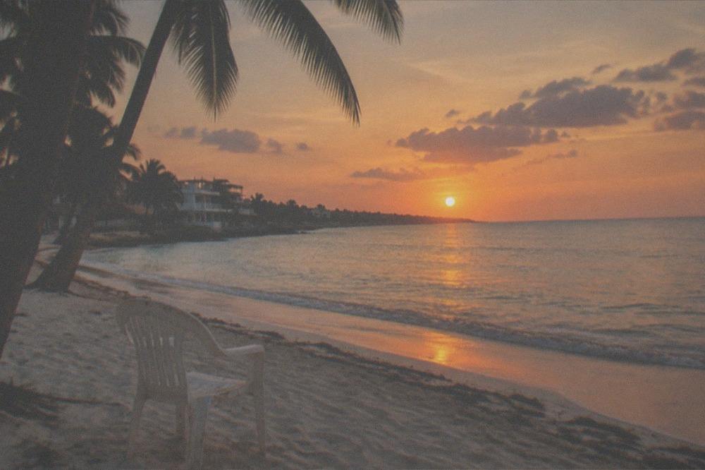 Sunset light over the Caribbean sea and a calm beach in Playa del Carmen with no people visible